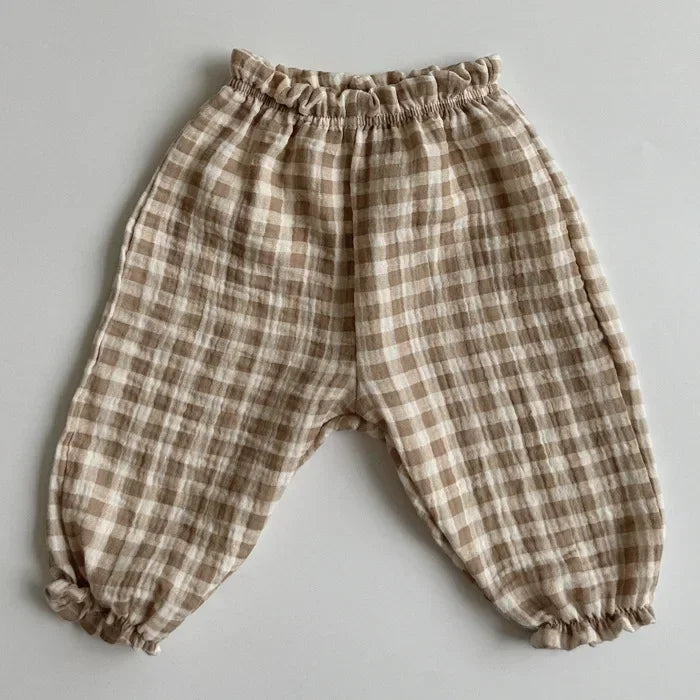 Soft muslin pants for babies from the BabyLove by Bubebaby collection. The pants are made of lightweight, breathable fabric with a gentle, stretchy waistband and a relaxed fit for comfort. The color is a soft, neutral tone, suitable for pairing with various baby tops
