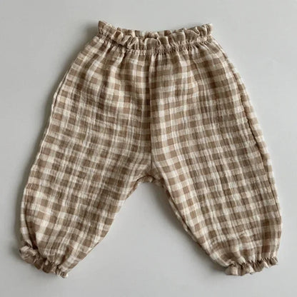 Soft muslin pants for babies from the BabyLove by Bubebaby collection. The pants are made of lightweight, breathable fabric with a gentle, stretchy waistband and a relaxed fit for comfort. The color is a soft, neutral tone, suitable for pairing with various baby tops