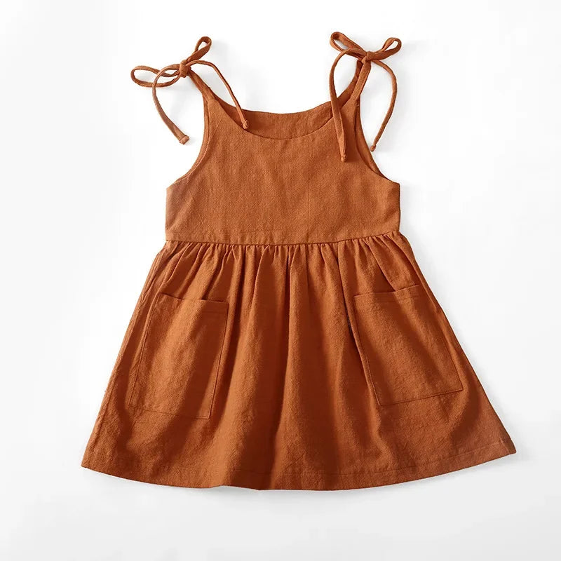 A BabyLove by Bubebaby light and breezy summer dress with spaghetti straps, designed for babies. The dress features a loose, relaxed fit and a soft, comfortable fabric, perfect for keeping little ones cool on warm days