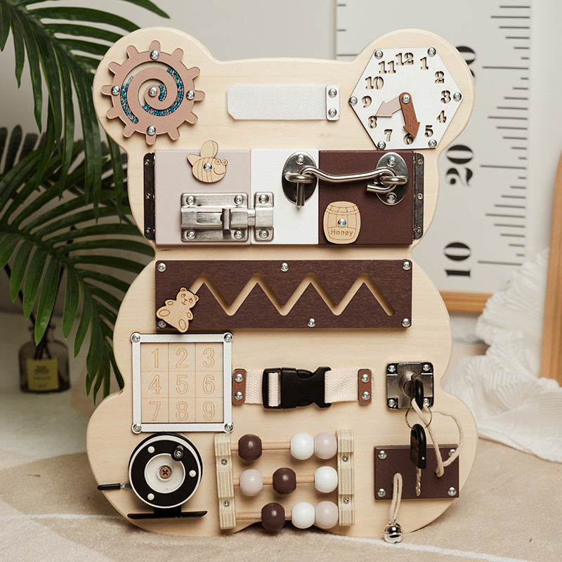 Bear wooden busy board standing in a playroom