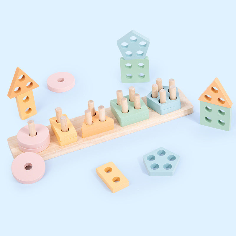 Pastel wooden shape stacker pieces laid out on blue background