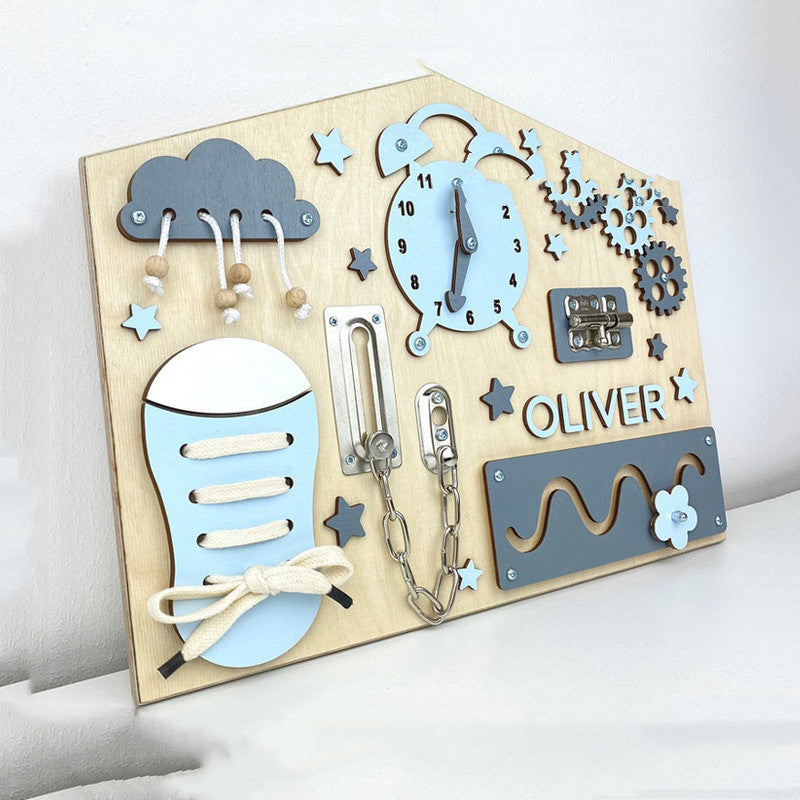 House shaped wooden busy board angled view