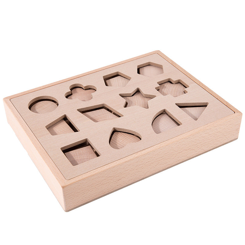 Natural wood shape sorting box on white background