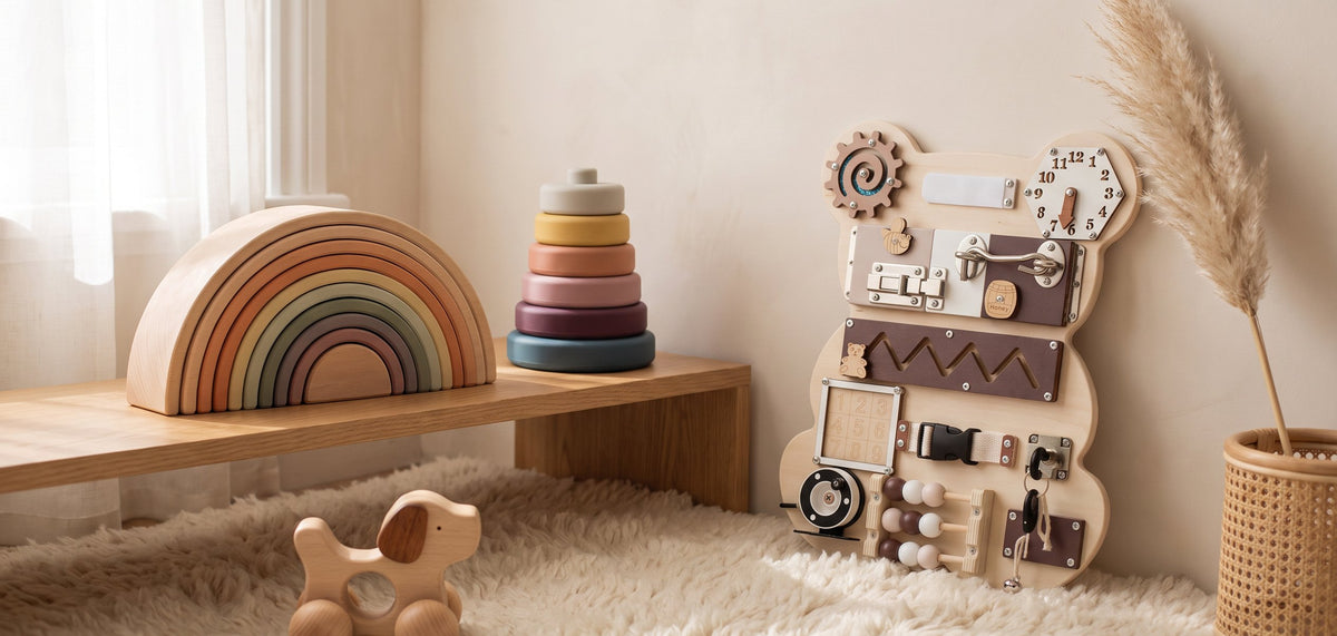 A nursery shelf with a rainbow stacker, ring tower, dog rattle and busy board
