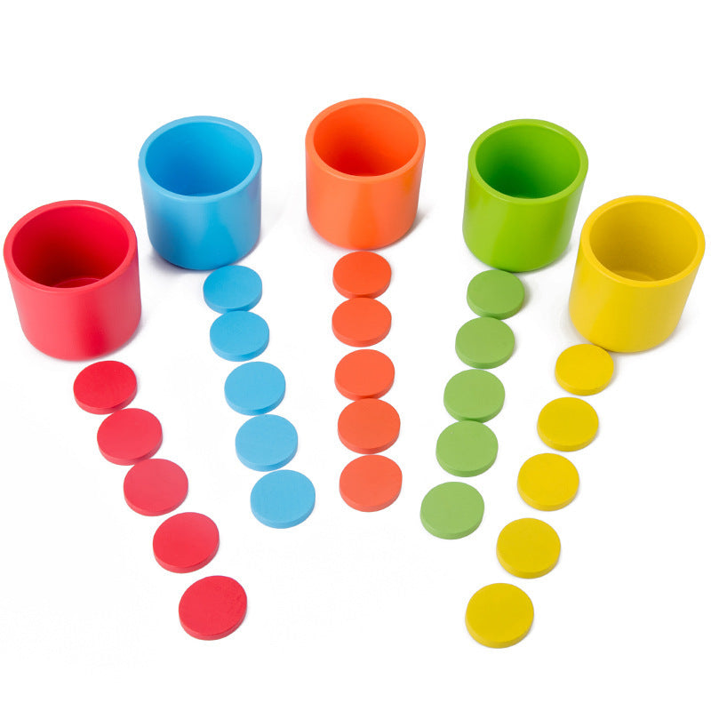 Wooden rainbow sorting cups game cups and discs on white background