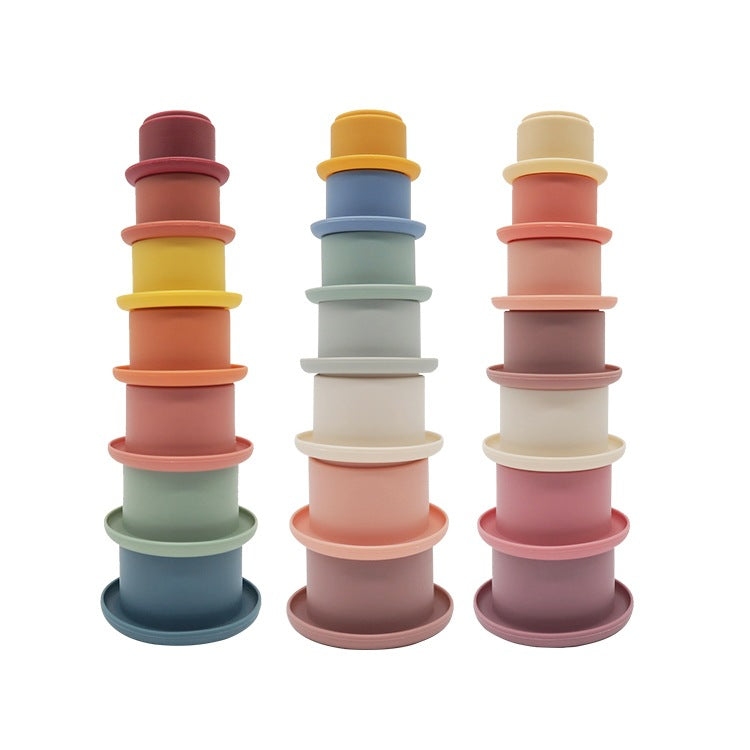 Silicone rainbow stacking cups built into three towers