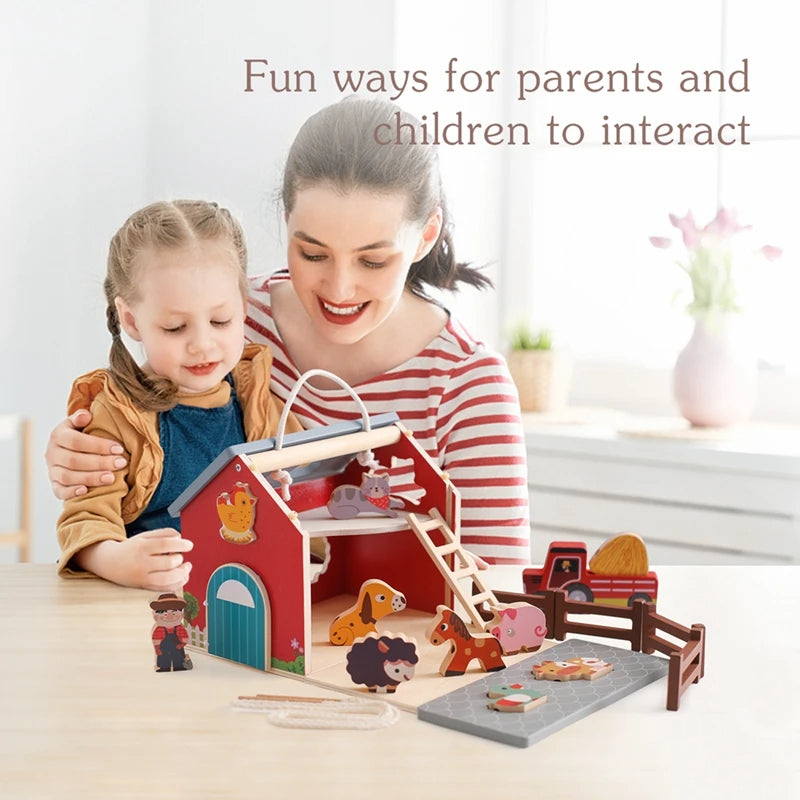 Parent and child playing with the wooden farm barn set