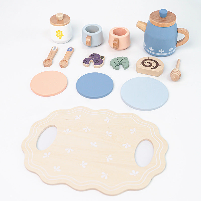 Wooden pretend tea set pieces laid out flat