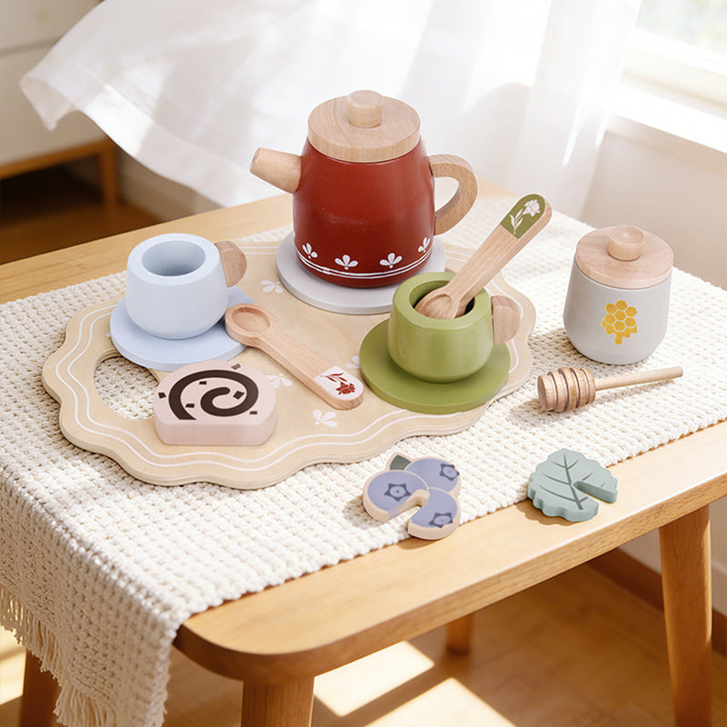 Red wooden tea set on a play table