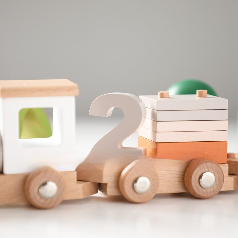 Wooden train carriage with number 2 and stacking blocks