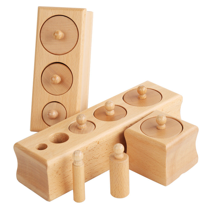 Knobbed cylinder blocks on white background